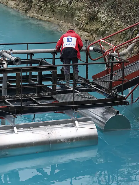 MAREX technician on a floating work pontoon with access gangway over open water